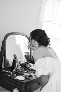 the bride doing her makeup!