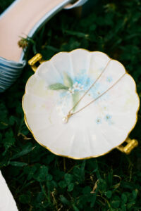 the brides necklace in a little ceramic dish