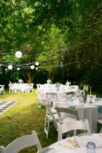 the wedding reception set up with all the tables and table decor
