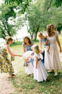 flower girls and guests arriving at the ceremony