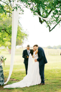 bride and groom kissing at the end of the ceremony