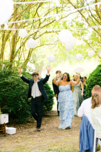 bridesmaid and groomsmen entering the reception