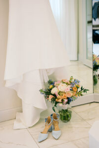 The bride's wedding dress, her shoes, and her bouquet!!