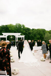 Bride walking down the aisle with the father of the bride
