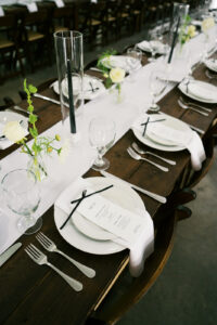 Black and white tablescape with greenery accents