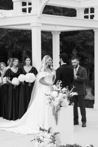 Black and white of the couple during the ceremony