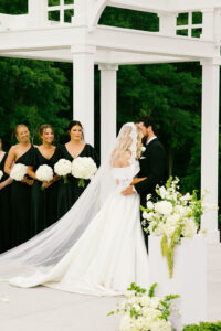 Bride and groom kissing during the ceremony